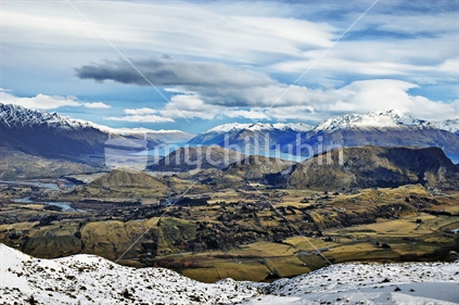View from the ski field on Coronet Peak towards  the Shotover River, Queenstown, The Remarkables and Lake Wakatipu, South Island, New Zealand