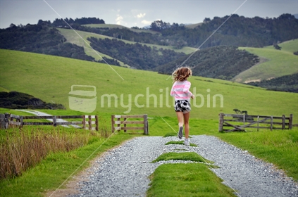 Girl running on a farm 