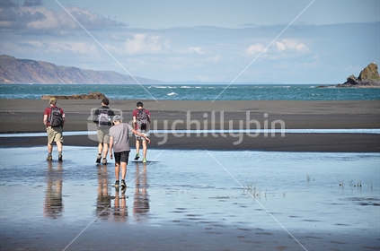 A family walk at Whatipu, Manukau Heads (selective focus and some motion blur)