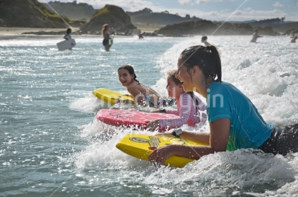 3 girls on boogie boards (selective focus)