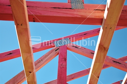 Timber framed construction against blue sky (selective focus)