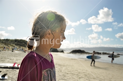 Girl watches surfers (see also Image #100468_833)