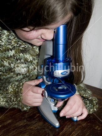 Girl using Microscope