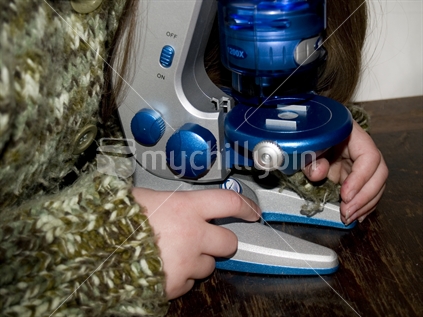 Girl using Microscope