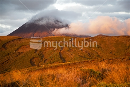 Last golden rays of the sunset on Mt Ngauruhoe and surrounds, viewed from the Tama Lakes hiking track, New Zealand