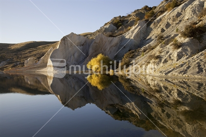 Reflections on Blue Lake, St Bathans, Central Otago at sunset
