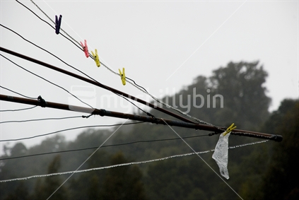 Static clothesline in misty rain 