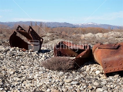Abandoned old gold dredge buckets; near Alexandra, Central Otago, New Zealand. 