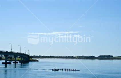 Rowers on a calm day by Tauranga bridge
