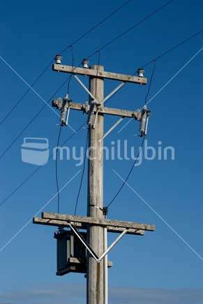 Wooden power pole with transformer