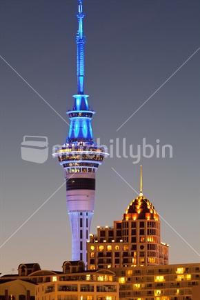 Auckland cityscape including two iconic buildings Skytower and Metropolis, in silver and gold. New Zealand