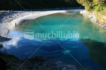 Tourist at the Blue Pools of Haast, New Zealand