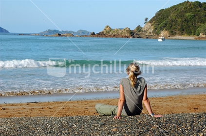 Woman sitting on the beach
