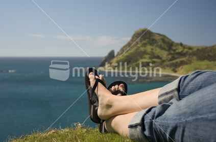 A Person relaxing in front of Coromandel coastline