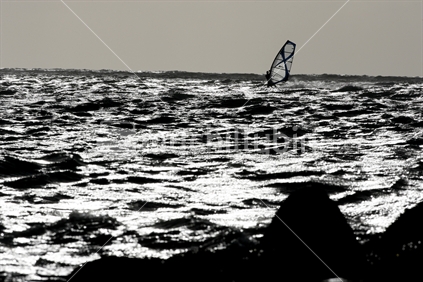Windsurfer on a choppy sea