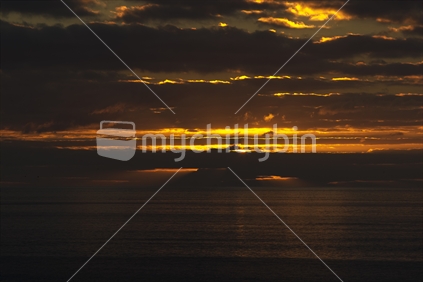 Sun setting behind the sea on West coast
