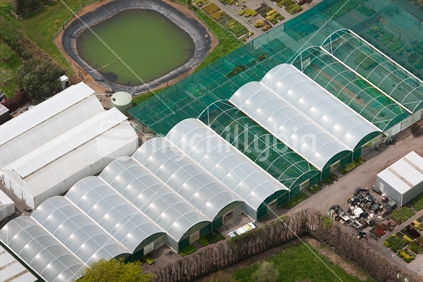 Aerial photo of a hothouses and rows of plants at a nursery.