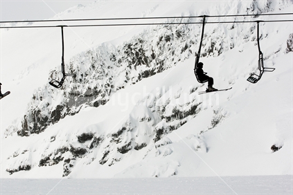 Skier on a chairlift at Whakapapa