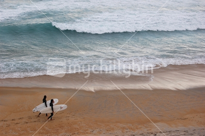 Two Surfers at St Kilda Beach in Dunedin