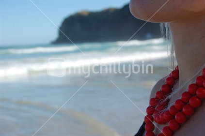 Still shot of a girl at Tomahawk beach, Dunedin.