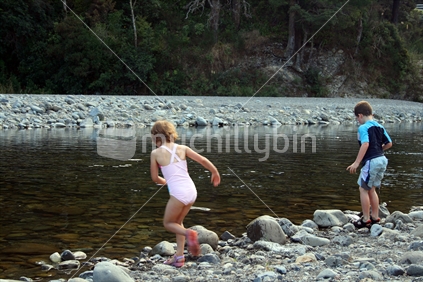 Kids swimming in the river
