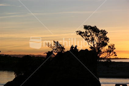 Kids playing at sunset, Whakatane, New Zealand