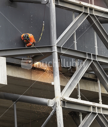 Cutting steelwork at height by torch.