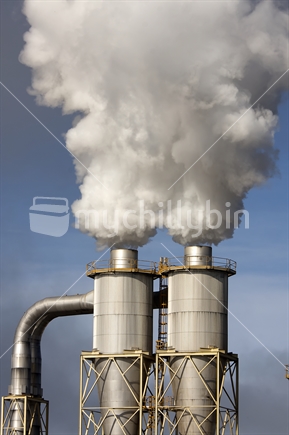 Industrial smoke stacks from Daiken wood processing factory near Rangiora, New Zealand.