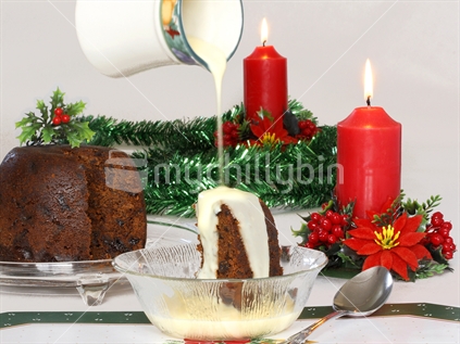 Tradition of Christmas, rich dark fruit pudding and custard
