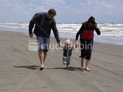 Family walking along the beach