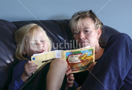 Girl reading for school homework.