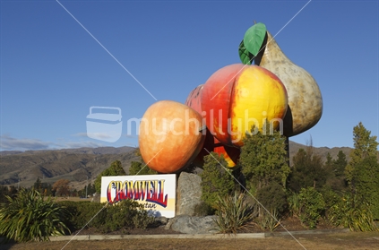 Cromwell town sign, and icon fruit.  New Zealand.