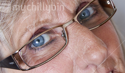Closeup of the eye with glasses on.