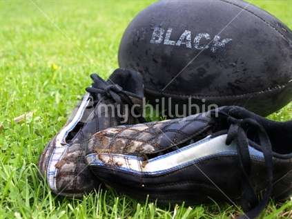 Muddy boots and ball