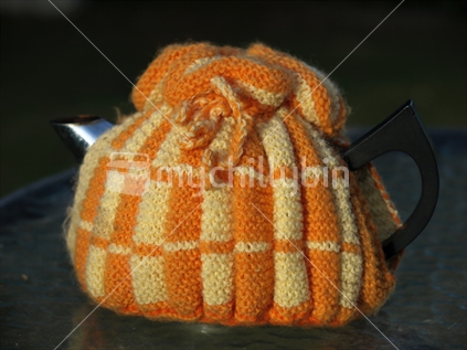 Knitted tea cosy on a pot of tea