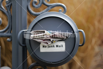No junk mail letter box, with local papers.  