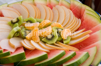 Platter of mixed fruit including Watermelon, Nashi, Mandarin and Kiwi Fruit