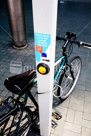Bike chained to Maxx bus stop in Auckland Supercity
