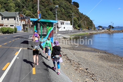 Kids walking through Mahina Bay, Eastbourne, Wellington