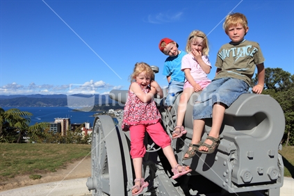 Young children on the cannon at Wellington Botanic Gardens