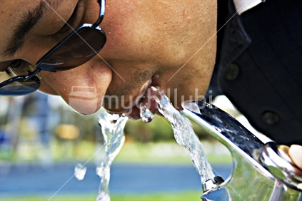 Adult having a drink of water