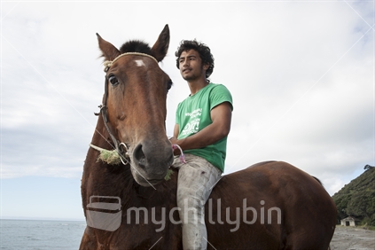 Horse and rider on Te Kaha beach