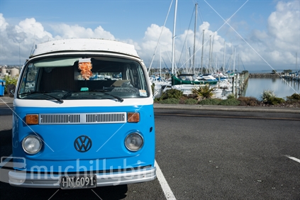 Blue and white 1973 volkswagen Kombi parked at Tauranga Marina.