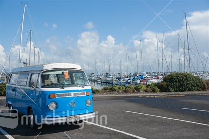 Kombi, retro VW blue and white parked at marine.