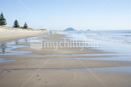 Scenic beach scene to Mount Maunganui in the distance.
