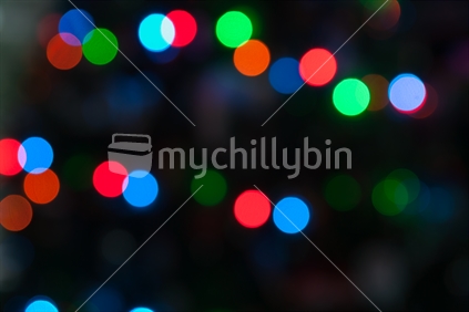 Christmas lights colorful bokeh defocused abstract pattern.