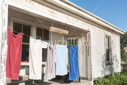 Towels drying on line outside shearers shed, typically New Zealand rural scene.