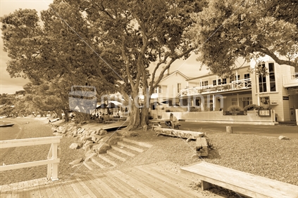 Russell waterfront steps to beach, deck and pohutukawa trees lining the road sepia toned , Bay of Islands, Far North North.