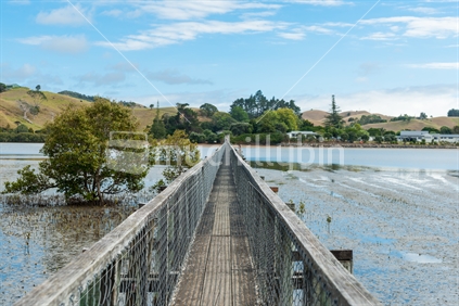 Whananaki bay and bridge, longest footbridge in NZ.