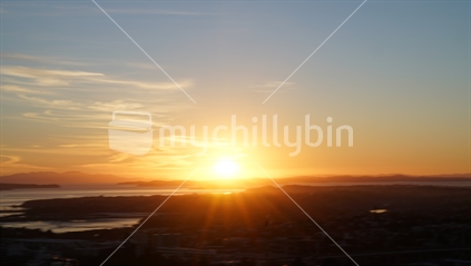 Sunrises defocused with abstract effecto over Auckland from top Mount Eden